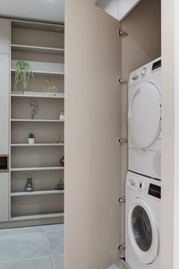 Modern home laundry room with washer and dryerCourtesy of Max Vakhtbovych